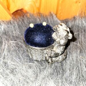 Small sewing pin cushion bear with a bow